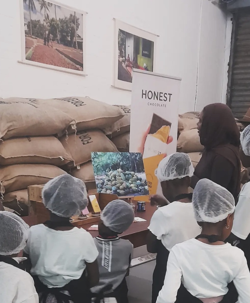 Children listening during their visit to the Honest Chocolate factory