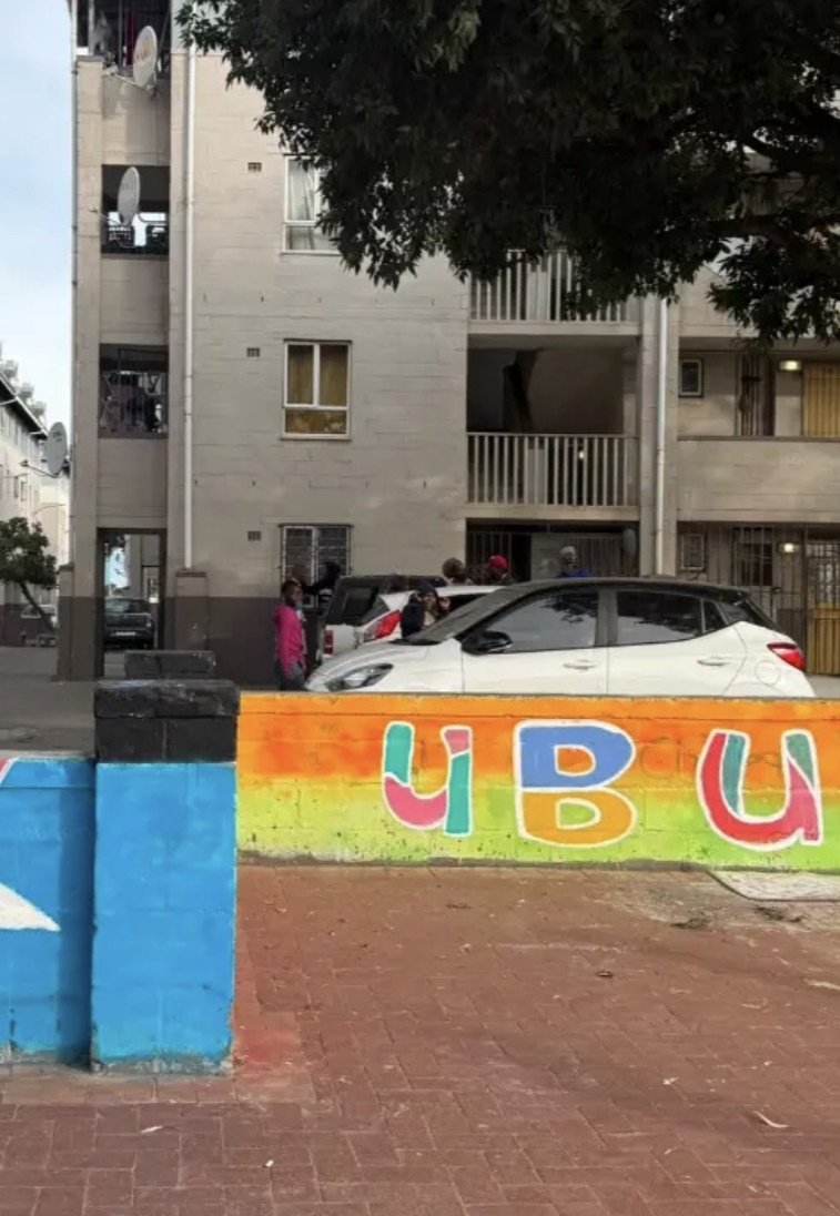 Colorful UBU mural on a community wall in Langa