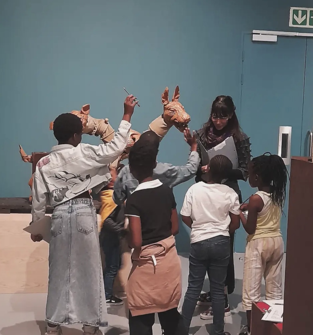Children exploring a sculpture together